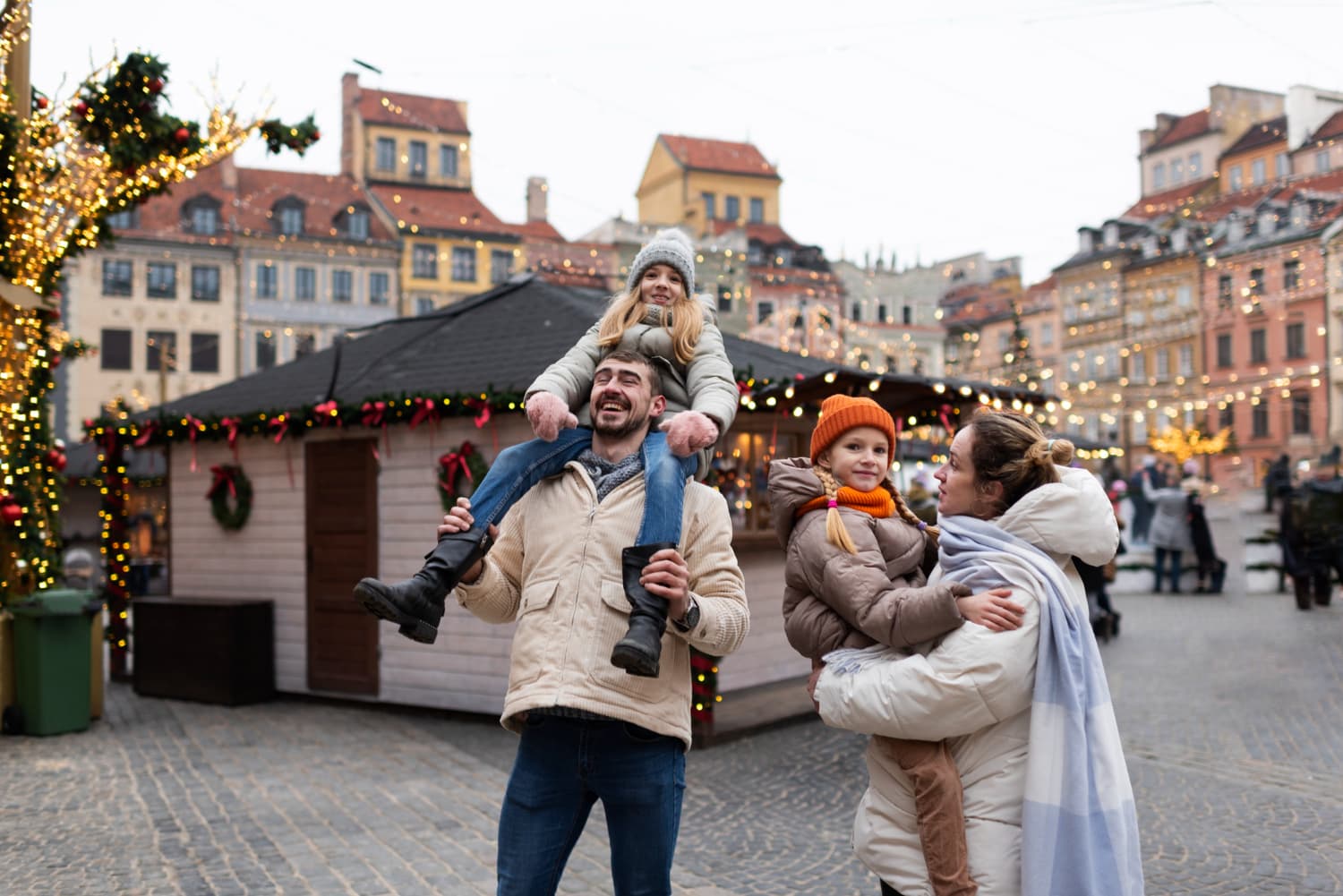 Family enjoying a Christmas market together in Prague's old town