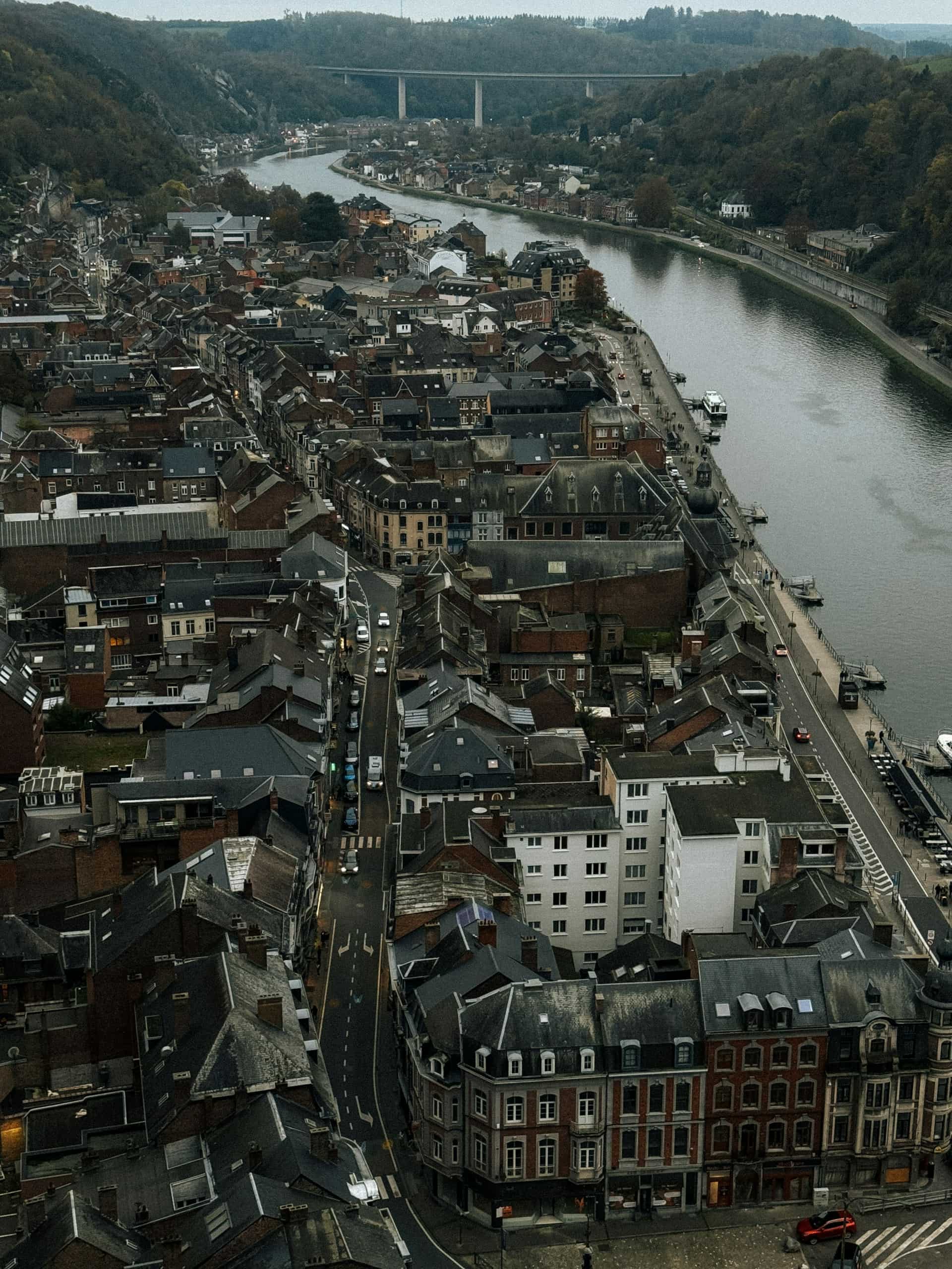 Aerial view of Dinant, Belgium, illustrating the mobile data market landscape where Belgian consumers pay some of the highest prices per GB in Europe.