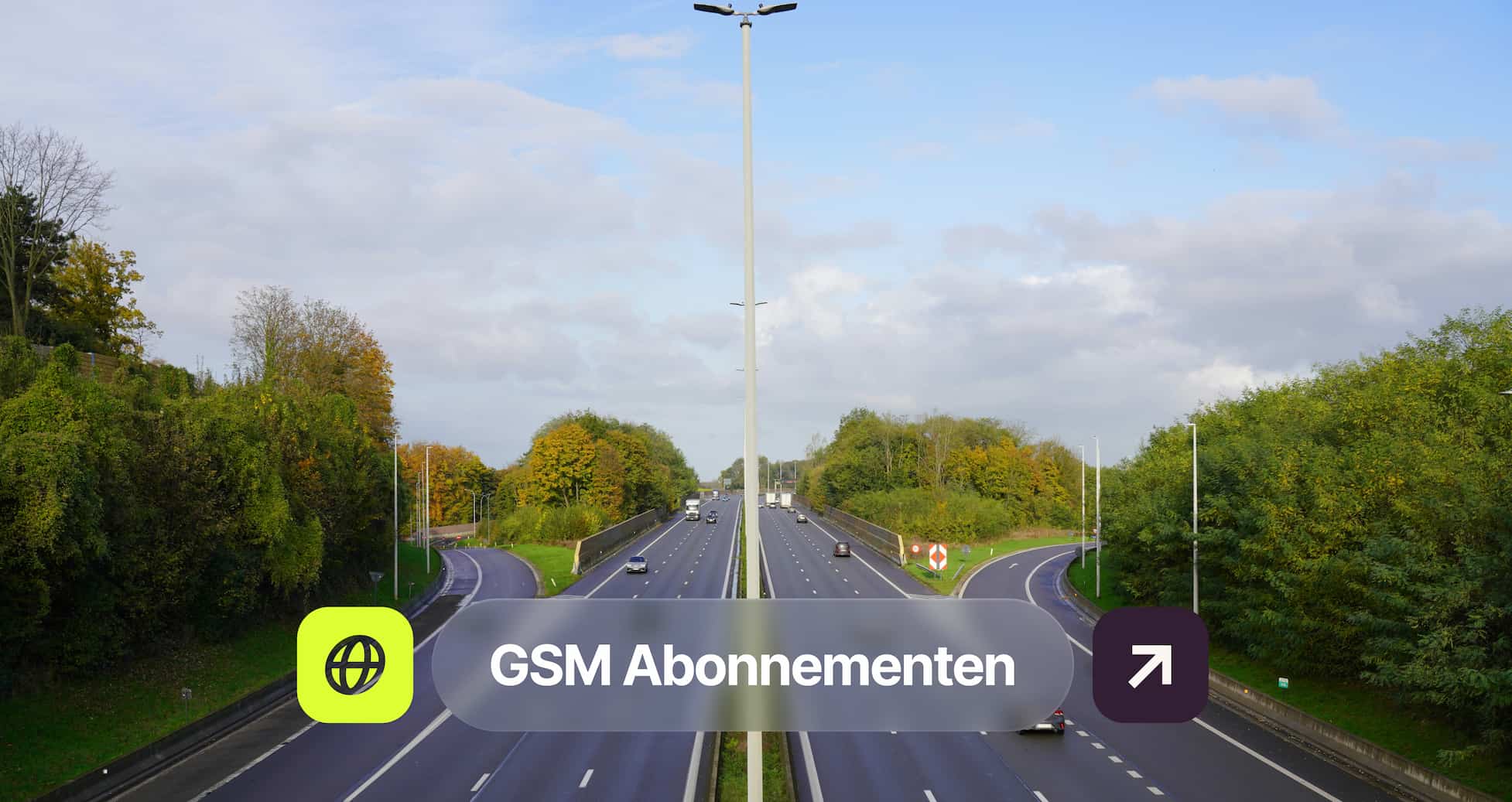 Aerial view of a highway divided by trees, with cars driving in both directions. A "GSM Abonnementen" overlay is visible on the image.