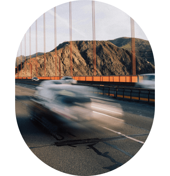 Cars crossing the Golden Gate Bridge in a circular frame