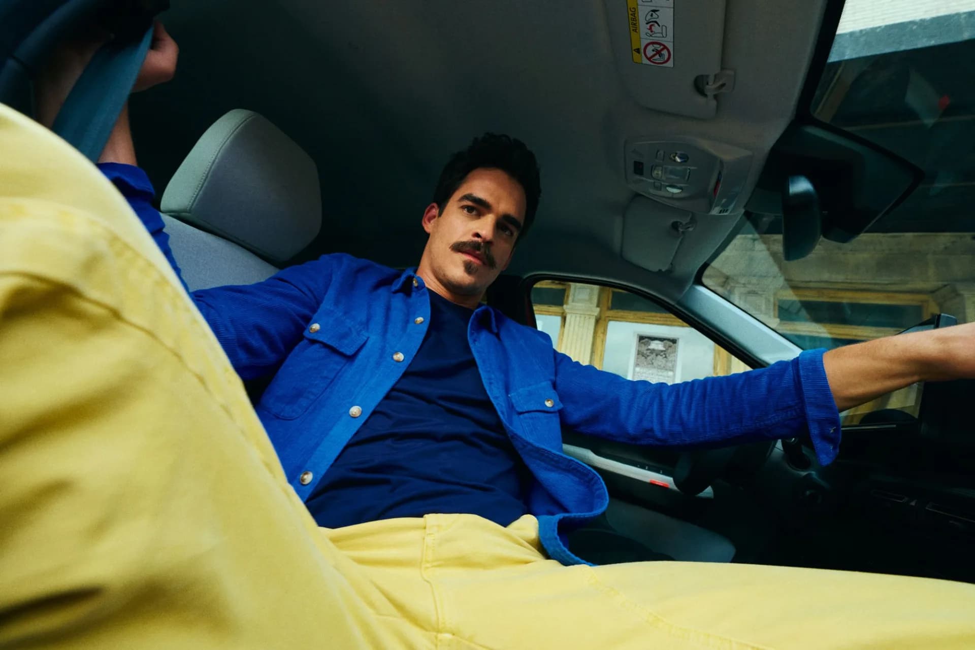 Passenger in the back of a car