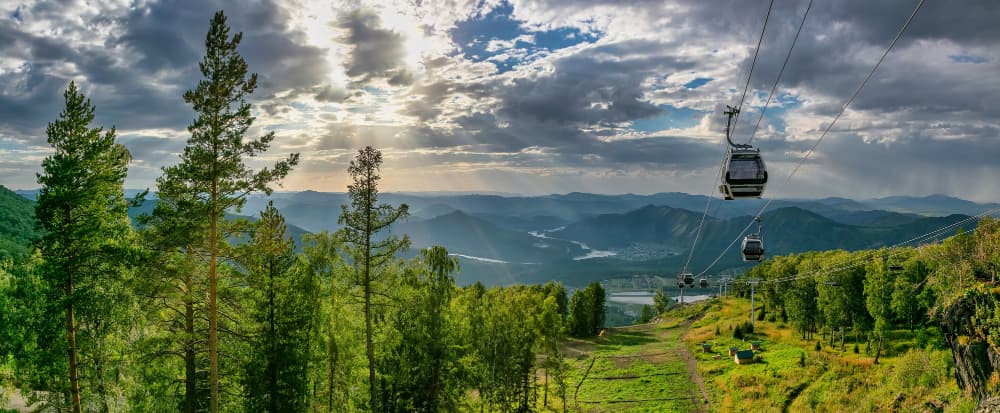 Cable car above forested mountains in Bansko, Bulgaria