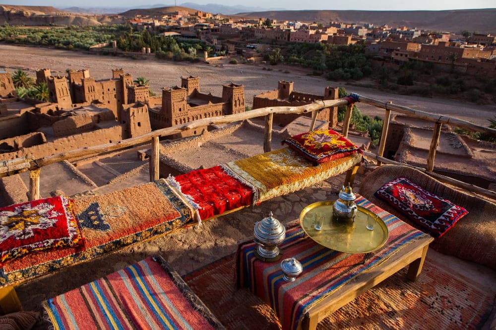 Traditional Moroccan rooftop with mint tea and desert views in Aït Benhaddou