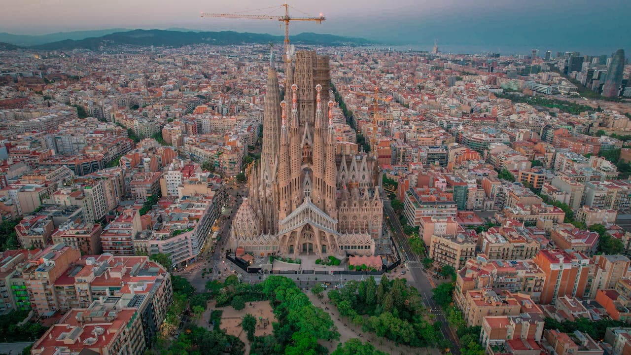 Aerial view of the Sagrada Familia basilica surrounded by cityscape in Barcelona, Spain