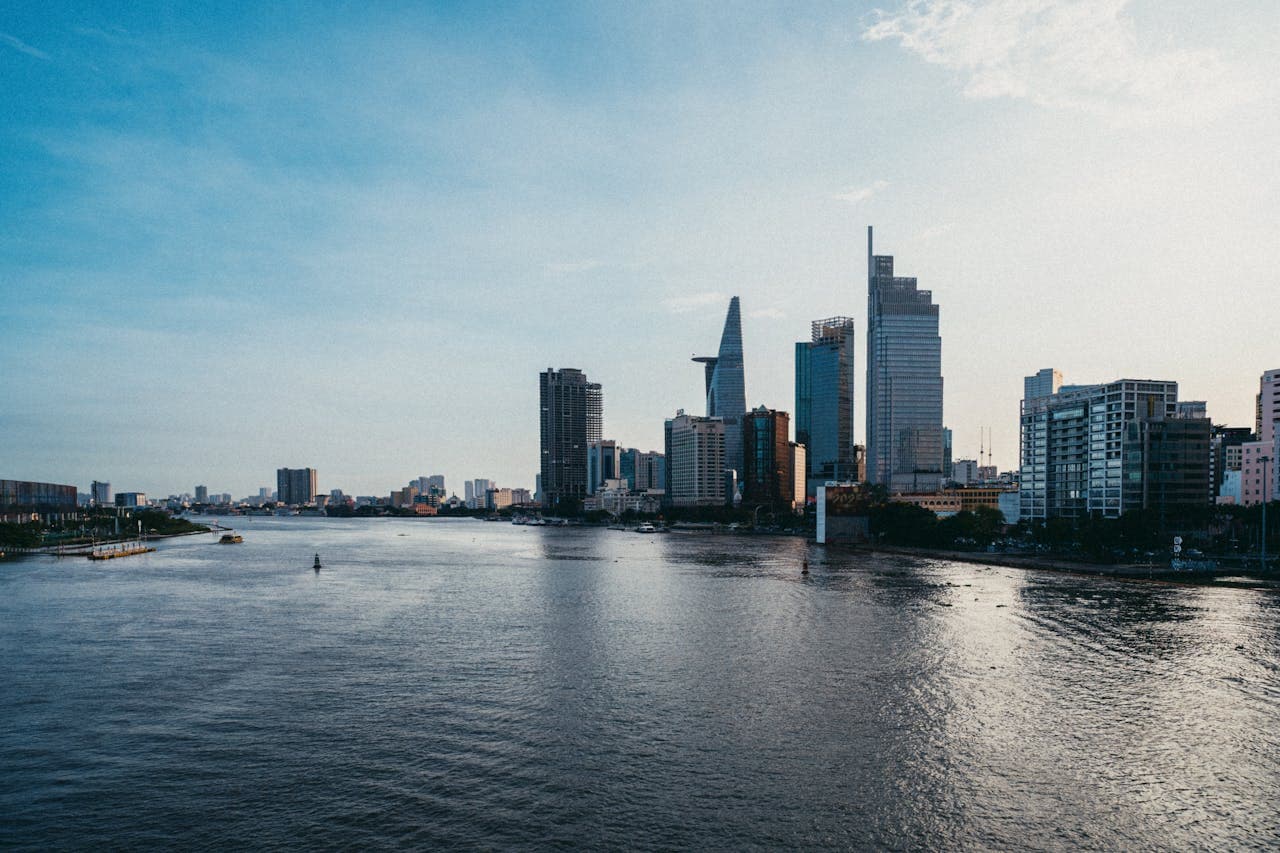 Panoramic view of Saigon skyline along the Saigon River with modern skyscrapers in Ho Chi Minh City, Vietnam