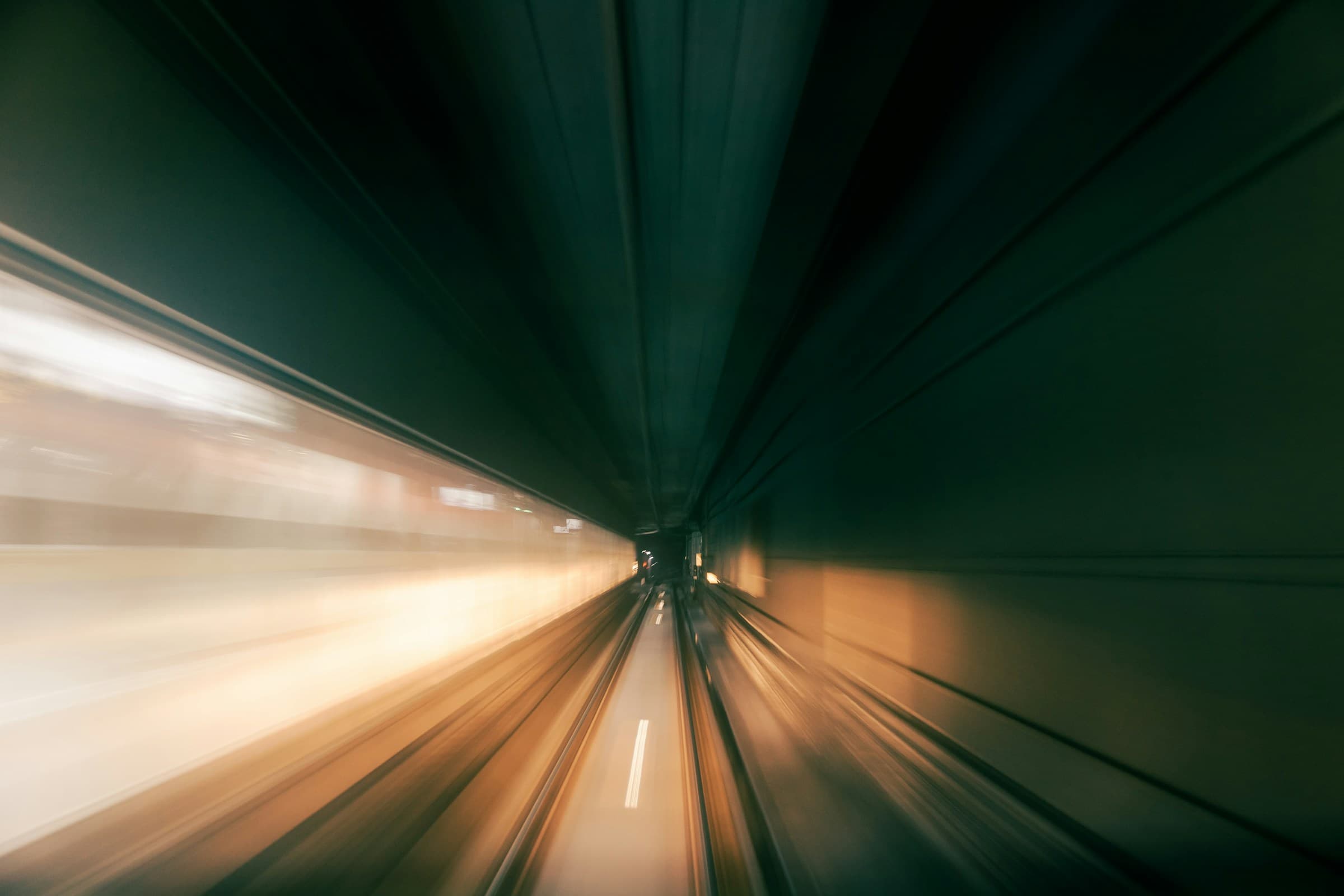 `A high-speed mobile internet connection visualised as motion blur through a tunnel, illustrating 4G and 5G network speed in Belgium`