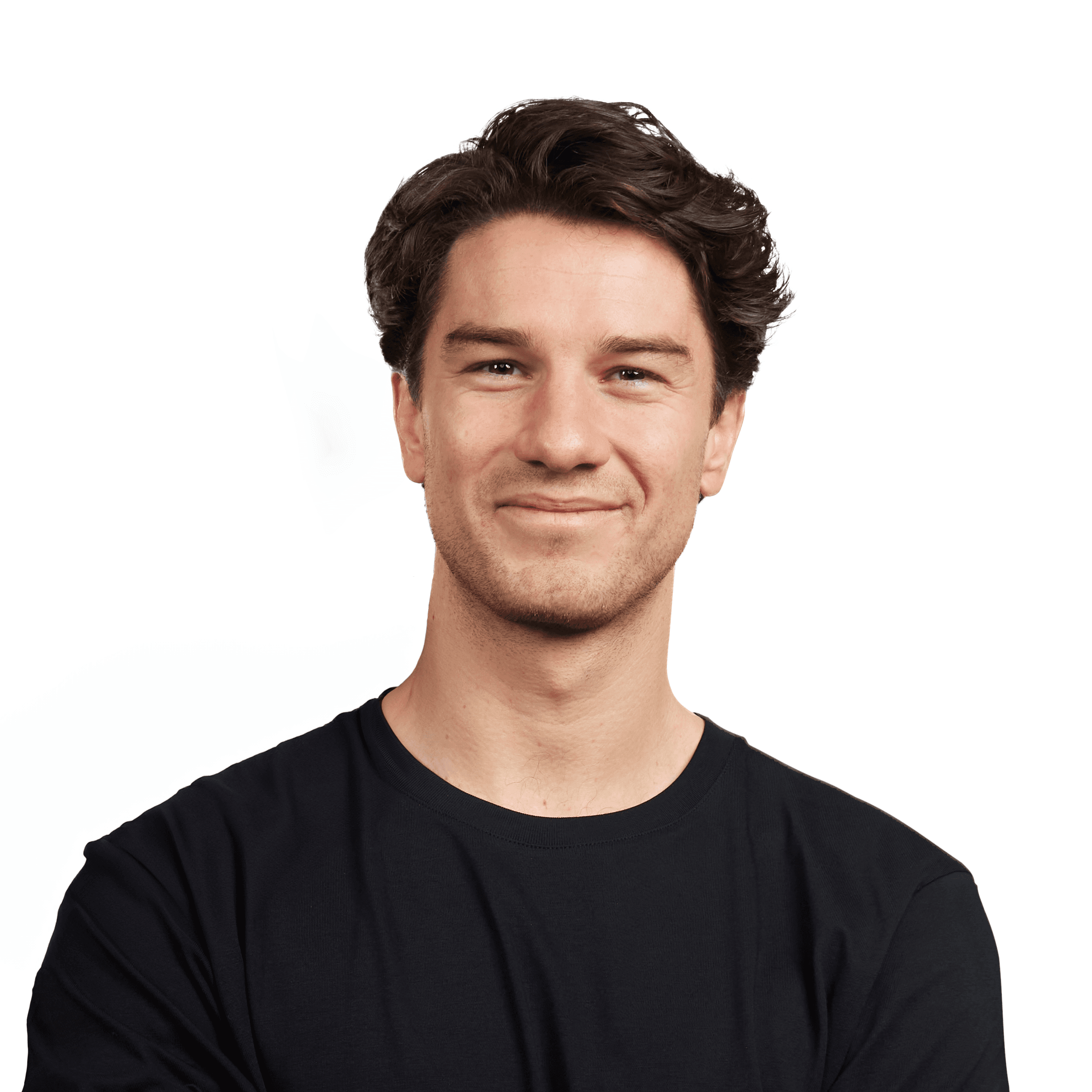 A smiling person with short, dark hair wearing a black shirt, against a white background.
