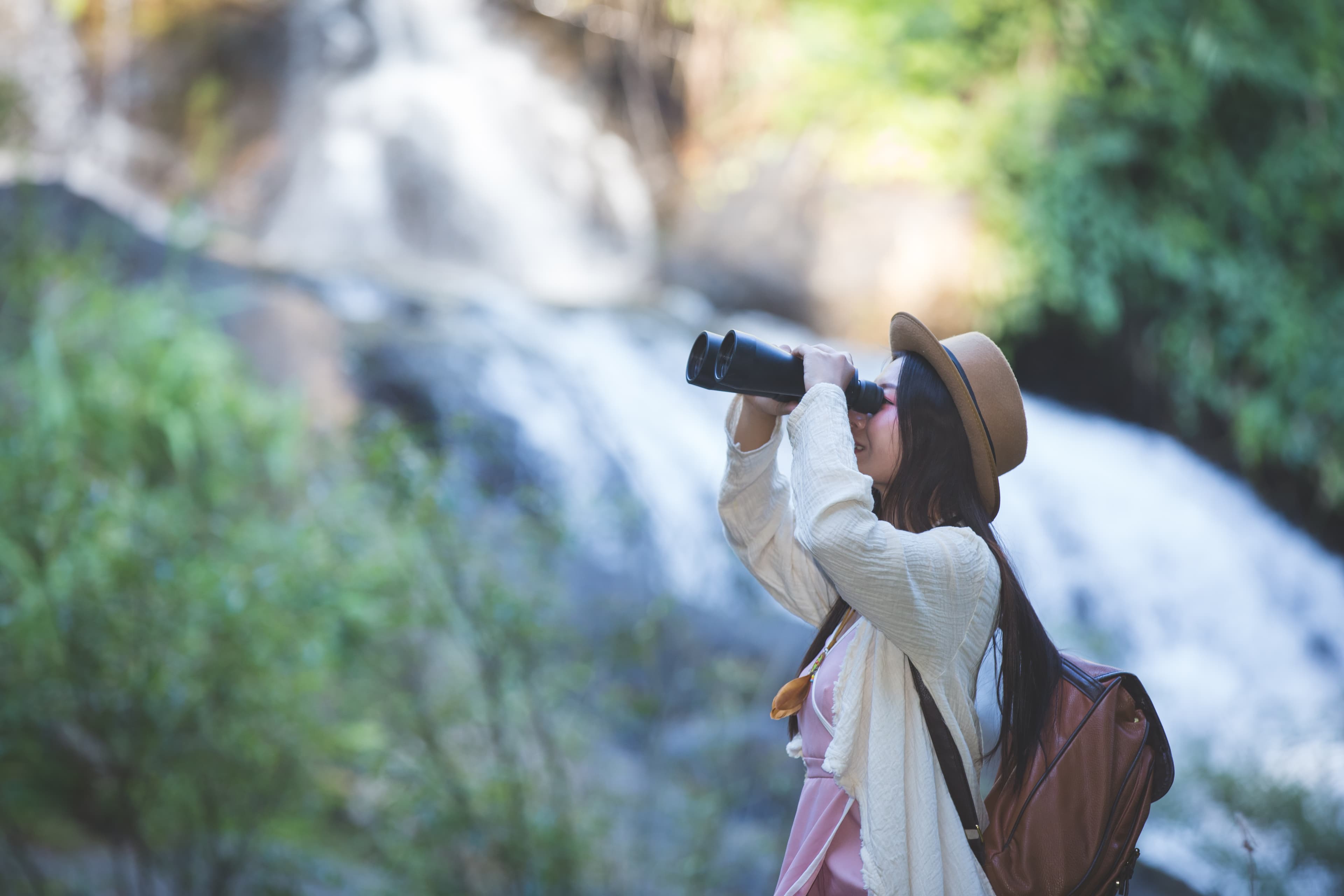 A woman birdwatching within the Ria Formosa National Park.