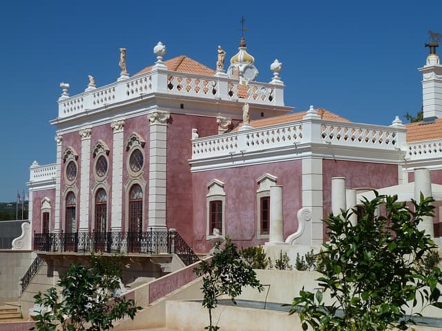 Pink rococo facade of the Palacio de Estoi near Faro, Portugal